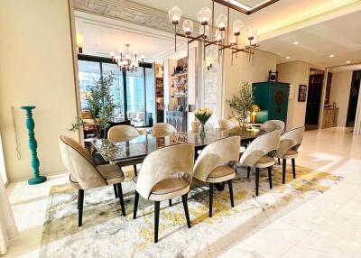 Elegant dining room with large glass table and modern chairs