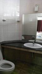 Modern bathroom with a large mirror and sink