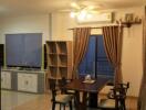 Dining area with kitchen in the background