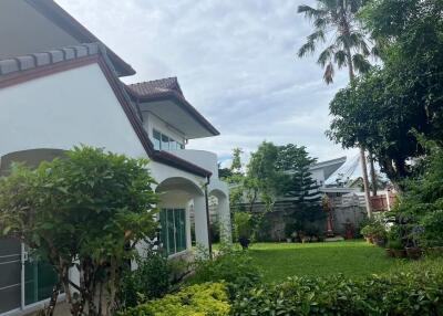 Exterior view of the property with a lush garden