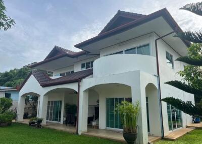 Two-story modern house with a lawn