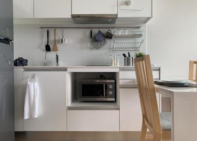 Modern kitchen with appliances and dining area