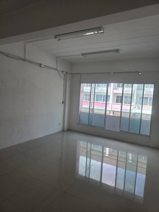 Empty living room with large window