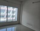 Empty room with large window