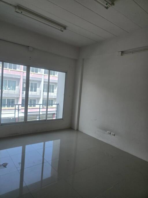 Empty room with large window