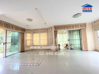 spacious living room with large windows and tiled floor