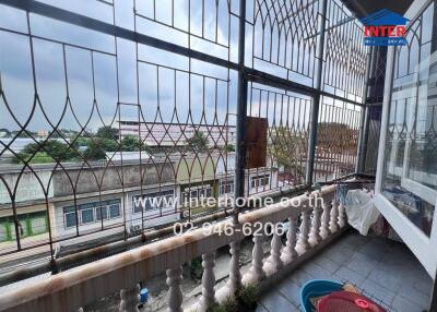 Balcony view with surrounding buildings