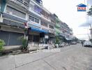 Street view of a building with multiple units and visible contact information for Inter Real Estate