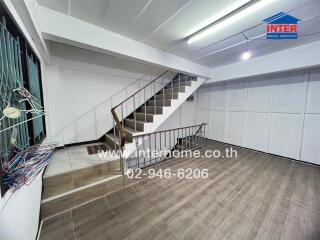 Spacious living area with staircase