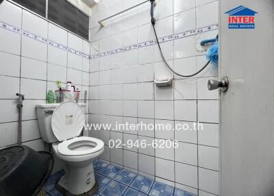 Bathroom with tiled walls and floor