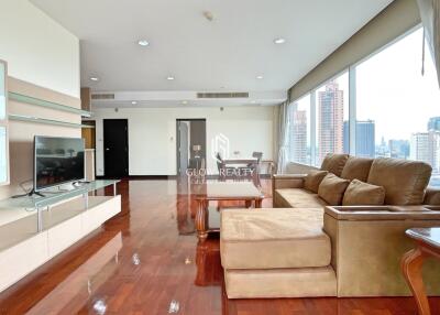 Modern living room with large windows and city view