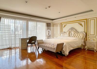 Elegant bedroom with luxurious furnishings and large windows