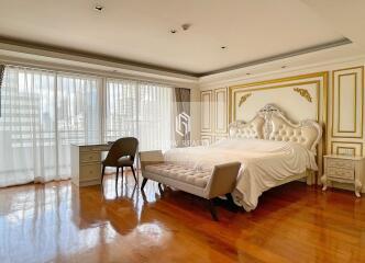 Elegant bedroom with luxurious furnishings and large windows