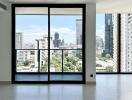 Modern living room with large glass doors offering a city view