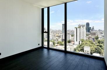 Modern living room with large window and city view