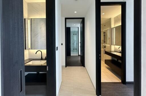 Modern hallway connecting to bathrooms and other rooms