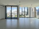 Spacious living room with large windows and city view