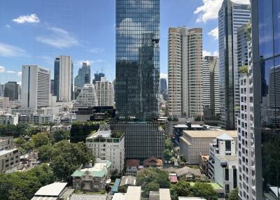 A skyline view of modern skyscrapers and high-rise buildings on a sunny day.