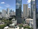 A skyline view of modern skyscrapers and high-rise buildings on a sunny day.