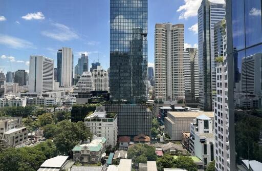 A skyline view of modern skyscrapers and high-rise buildings on a sunny day.