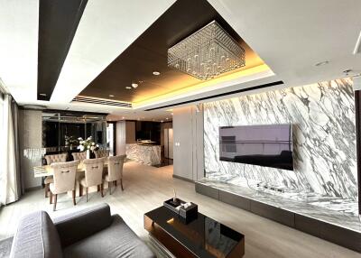 Modern living and dining area with marble accents