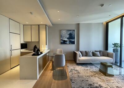 Modern living area with open kitchen and sitting area