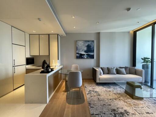 Modern living area with open kitchen and sitting area