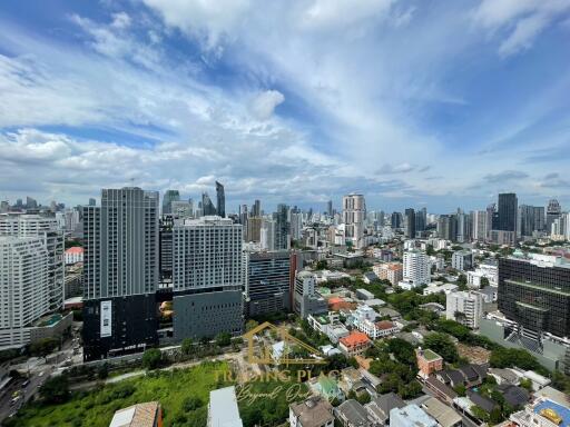 Aerial view of city skyline with skyscrapers and residential buildings