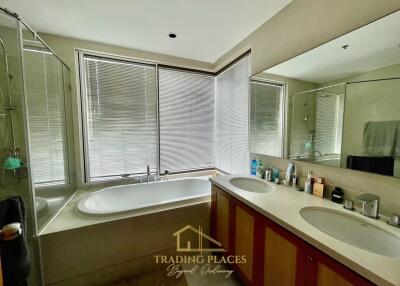 Modern bathroom with large bathtub and double sink