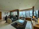 Spacious modern living room with large windows and city view