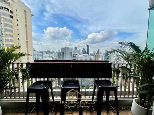 City view from balcony with seating