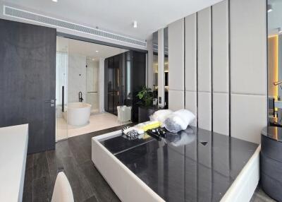 Modern bedroom with ensuite bathroom and luxurious furnishings