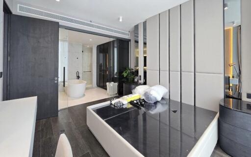 Modern bedroom with ensuite bathroom and luxurious furnishings