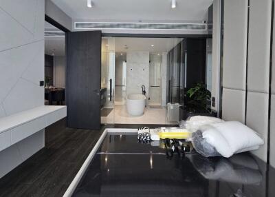 Bedroom with modern interior design and a view into the bathroom