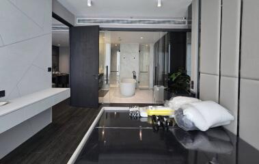 Bedroom with modern interior design and a view into the bathroom