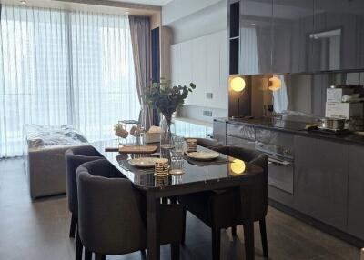 Modern kitchen with dining area and large windows