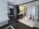 Modern bathroom with glass enclosure and freestanding tub