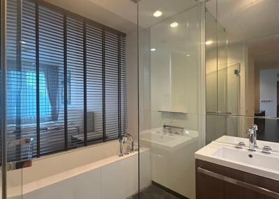 Modern bathroom with glass shower and bathtub