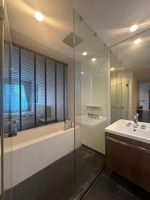 Modern bathroom with glass shower and bathtub