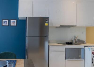 Modern kitchen with blue accent wall