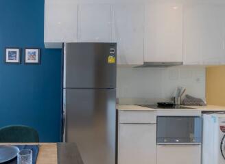 Modern kitchen with blue accent wall