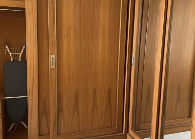 Wooden wardrobe with sliding doors and mirrored closets