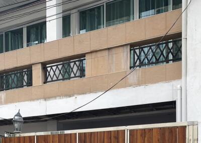 Exterior view of a building with wooden gate