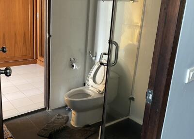 Modern bathroom with glass shower enclosure and toilet