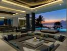 Beautiful open-plan living area with ocean view at sunset