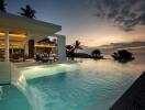 Luxurious outdoor space with infinity pool and ocean view at sunset