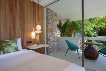 Bedroom with large window and outdoor view