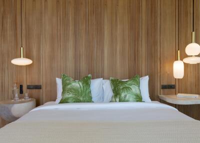 Modern bedroom with wooden accent wall and green pillows