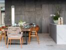 Modern dining area with a wooden table, stylish chairs, and decorative elements.