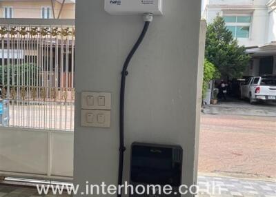 Electric vehicle charging station in driveway